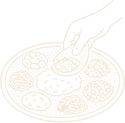 Injera scooping Ethiopian stew from a shared platter